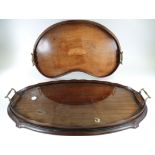 A late 19th or early 20th Century kidney shaped twin handled tray with central shell motif, 57cm x