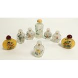 A small group of Chinese reverse glass painted snuff bottles, including a near pair decorated with