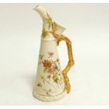 A Royal Worcester blush ivory porcelain ewer, the handle naturalistically moulded in the form of a