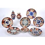 A small collection of Imari ware, to include a pair of dishes with central flying bird design,