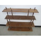 A 19th Century walnut hanging wall shelf, four shelves untied by turned supports, 83cm x 21cm x 89cm