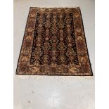 Old Middle Eastern Rug, a bordered example with overall geometric and stylised floral detail on a