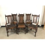 A set of six reproduction oak Carolean dining chairs, rattan back supports and drop in vinyl