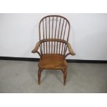 An antique Windsor chair, some cracks