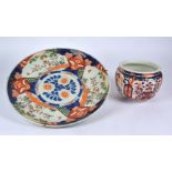 A 19th Century Japanese Imari charger, the central floral medallion surrounded by alternating