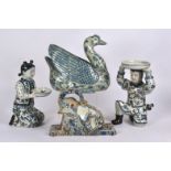 A 20th Century oriental blue and white figure of a duck, with decoration of bats, flowers and