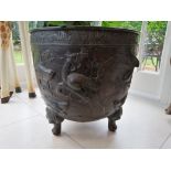 A bronzed cast early 20th Century jardinière, raised on four mythical beast feet, with continuous