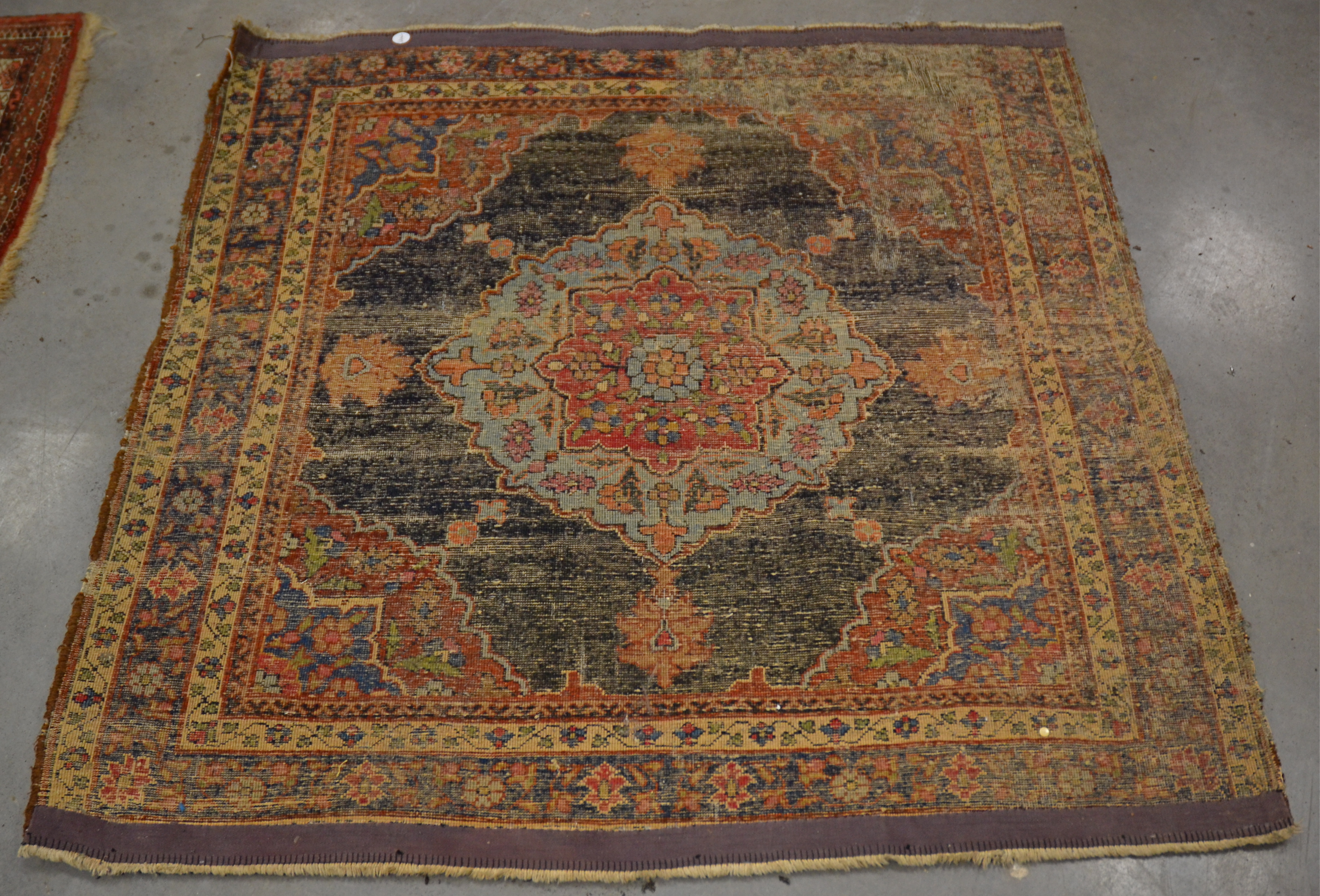 A Middle Eastern rug of near square proportions, with central octofoil shape, surrounded by a - Image 2 of 6