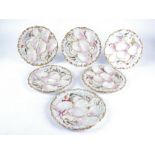 A group of nine late 19th Century or early 20th Continental porcelain oyster dishes, moulded with