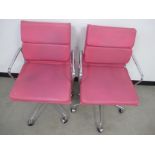 A pair of contemporary Eames style low back soft pad chairs, chrome frames and upholstered in a faux