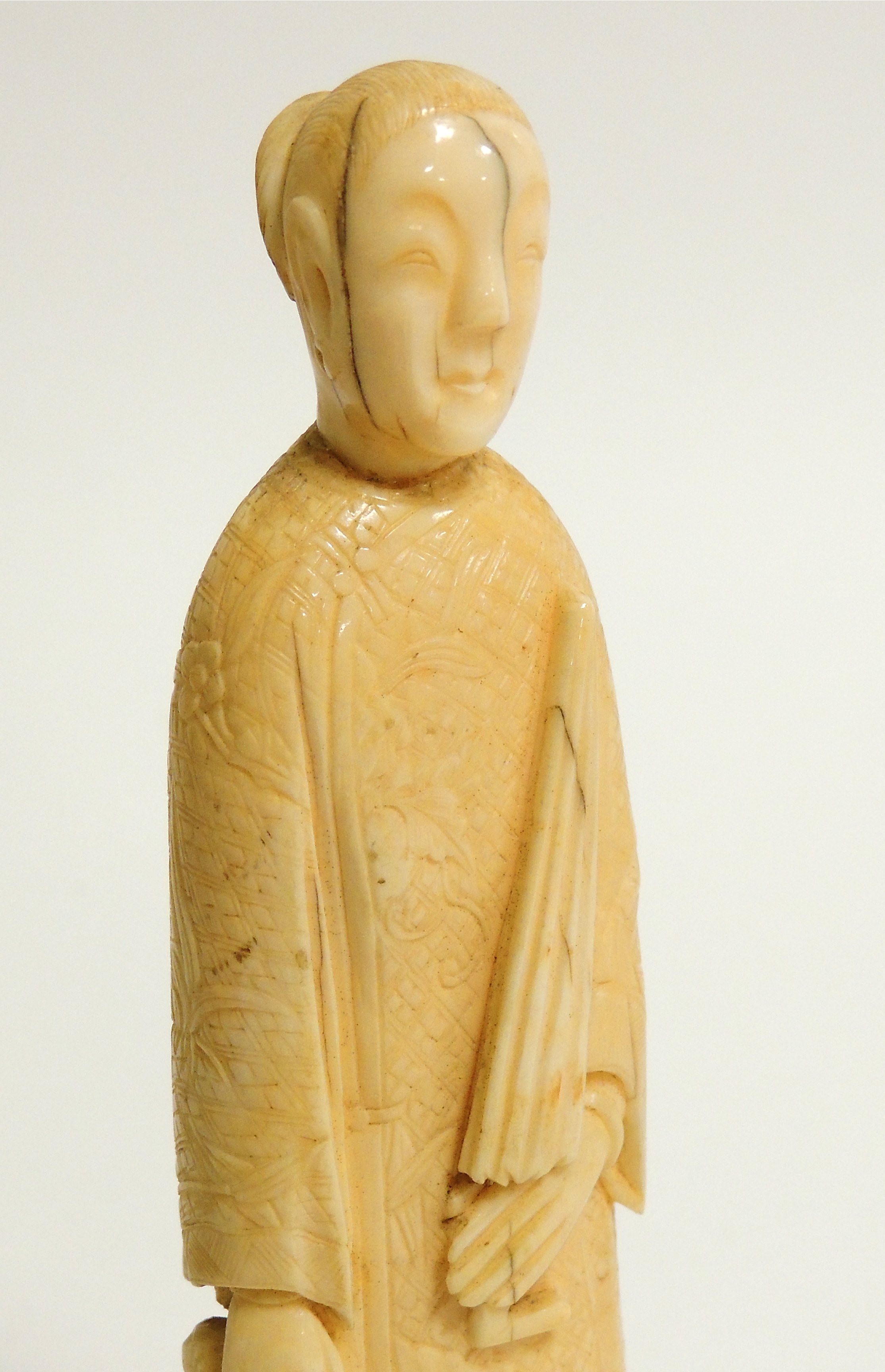 A Chinese marine ivory carving of a lady with an umbrella, probably walrus, with a young child and - Image 4 of 4