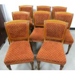 A set of eight 19th Century oak dining chairs, in the style of Gillows, with padded backs and