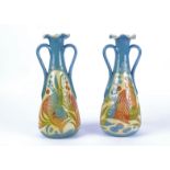 Alexander Lauder (1836-1921) a pair of Barum pottery twin handled Arts & Crafts vases, with stylised