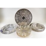 A quantity of silver plated wares, predominantly circular trays, pierced and with scrolling