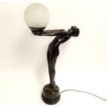 A contemporary composite lamp in the Art Deco style, formed as a nude female with arms
