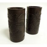 A pair of 20th Century bamboo brush pots, with original retailer's receipt inside, of cylindrical
