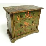 A Japanese small collectors cabinet, or chest of drawers, with three long drawers, raised on bun