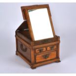 A 20th Century Chinese hardwood dressing table box, of rectangular form, the top lifting to reveal