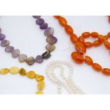 A string of amber knotted strung butterscotch polished beads, 24g, an Asian amethyst and white metal