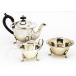 A George V silver three piece bachelors tea set from EV, shaped flared rims to teapot, sugar basin