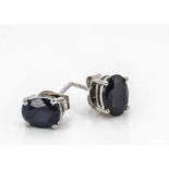 A pair of silver set sapphire ear studs