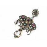 An Austro Hungarian garnet, turquoise and mother of pearl drop pendant, the foil back stones in a