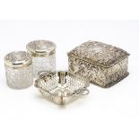 A late Victorian silver dressing table box, together with two cut glass and silver topped pots,