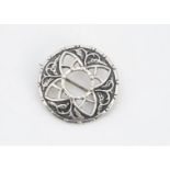A contemporary silver iona Celtic brooch, designed by John Heart of circular design with pierced