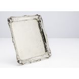 An Edwardian silver tray, squared with shaped and pierced rim, 10.7ozt, 22cm