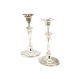 A pair of late Victorian silver filled candlesticks by Thomas Bradbury, AF, Regency style with