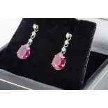 A pair of ruby and diamond drop earrings, pear shaped rubies on diamond chain drops, 1.8cm, boxed,