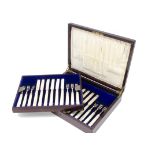 A George V part set of silver and mother of pearl dessert knives and forks from Mappin & Webb, in