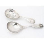 Two Victorian silver tea caddy spoons, one fiddle pattern with engraved bowl and handle, the other