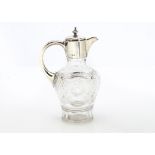 A nice Edwardian cut glass and silver mounted claret jug, with applied silver handle and hinged lid,