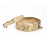 Two 9ct gold bangles, both 5.5cm internal diameter, one slightly af, the other with star cut design,