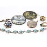 Two Russian mother of pearl miniature painted oval brooches, depicting a winter landscape and wooded