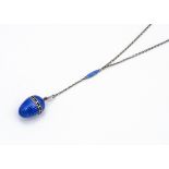 A continental white metal guilloche enamel perfume pendant and chain, the egg shaped pendant with