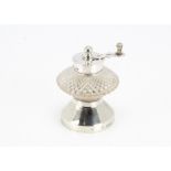 A late Victorian silver and cut glass pepper mill by Hukin & Heath, flared base with cut glass well,