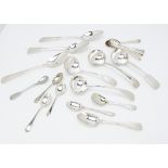 A small collection of silver and silver plated spoons, including a set of six George V old English