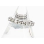 A diamond full eternity band, in white metal, old cut stones in raised claw settings, ring size P,