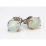 A pair of white Ethiopian opal ear studs in silver