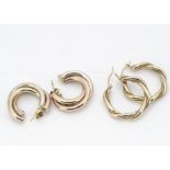 Two pairs of circular gold earrings, one of rope twist design, the other in two colours, 8.5g