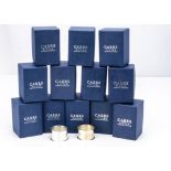 A set of twelve modern and unused silver napkin rings from Carrs, each plain hallmarked ring in card