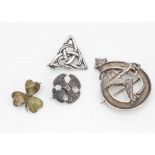 A collection of silver Celtic brooches, including a Connemara marble silver set clover leaf, a