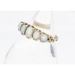 A contemporary 9ct gold Victorian style five stone opal ring, the oval polished cabochons in claw