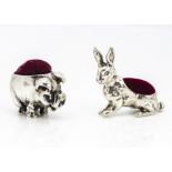 Two modern white metal miniature pin cushions, modelled as a pig, 2.5cm long, and a rabbit, 3cm
