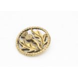 A 9ct gold iona pin brooch, by John Heart decorated with thistle design within a rope twist