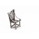 A continental miniature white metal chair, 2.4cm high, with throne style back and barley twist