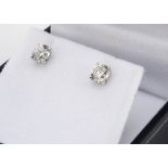 A pair of brilliant cut diamond ear studs, in claw settings, 18ct white gold, boxed, total diamond