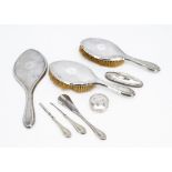 An Art Deco period silver dressing table set, with pair of hair brushes, hand mirror, together